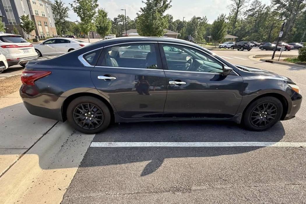 A grey sedan as it is now, with clear windows